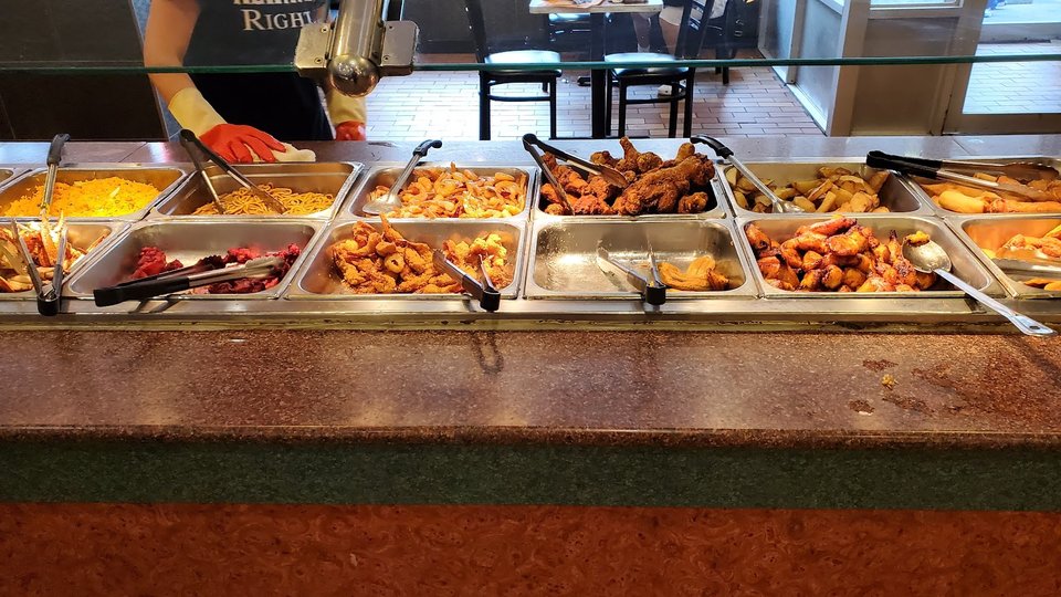 Fresh food behind a buffet counter